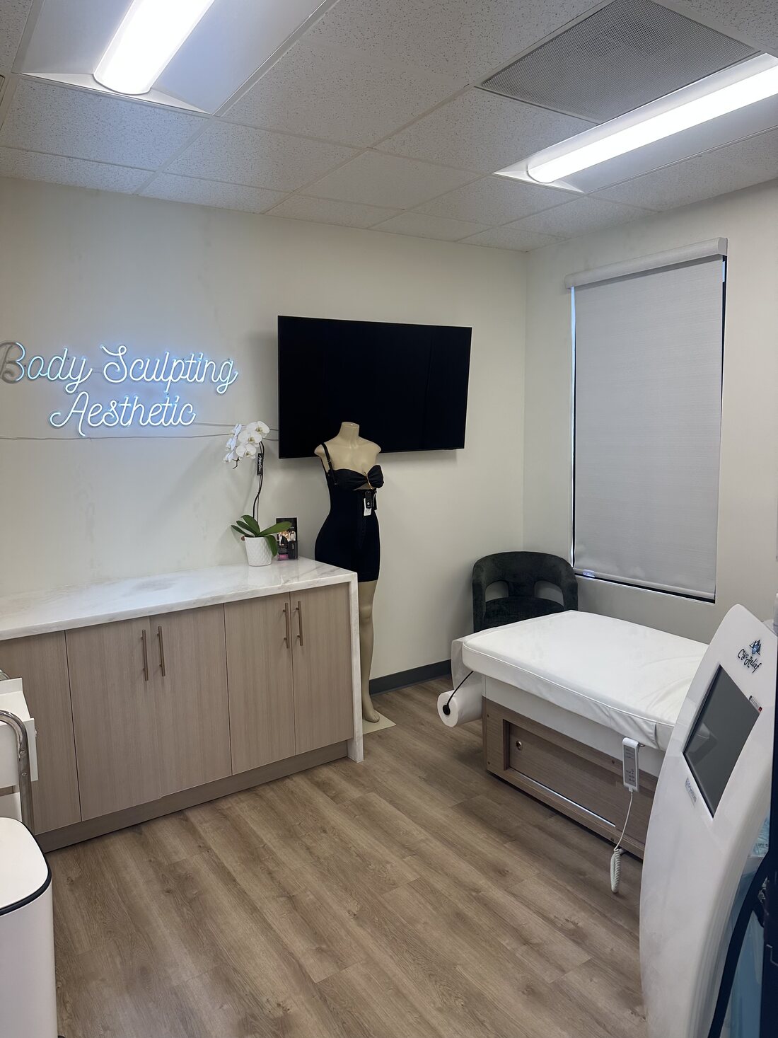 Treatment room with neon sign